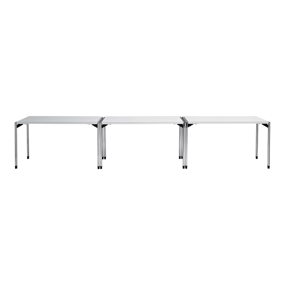 Modern silver metal table with a sleek, minimalist design and smooth white top. Ideal for stylish interiors.