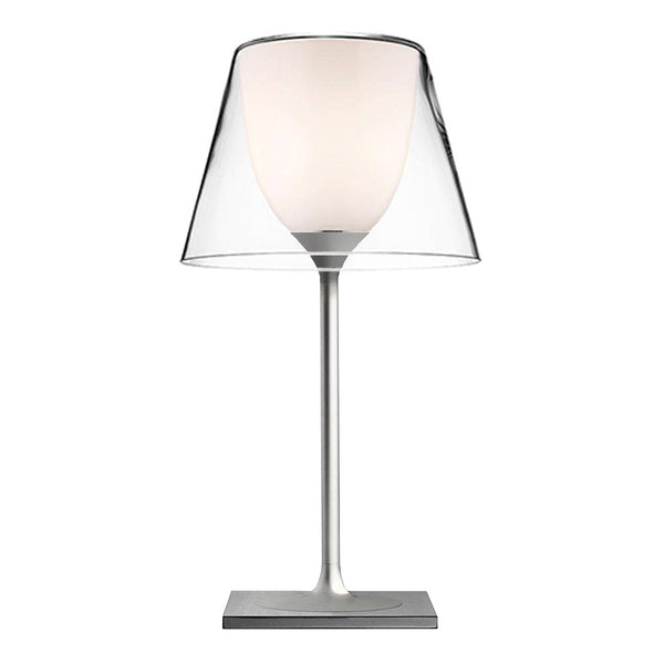 Sleek clear acrylic lamp with a minimalist design and soft white shade, featuring a modern silver base.