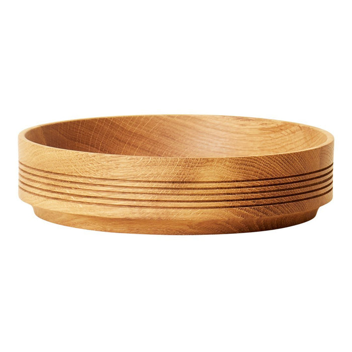 Natural wooden bowl with a smooth finish and subtle grooved pattern in light brown hues. Perfect for home decor.