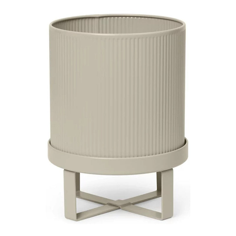 Beige ribbed planter with a stylish stand, featuring subtle texture and a modern design. Perfect for any decor.
