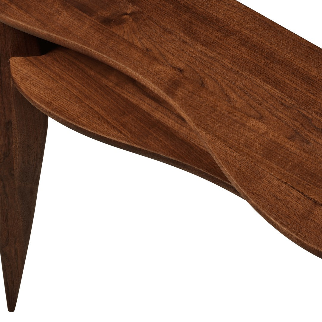 Elegant walnut wood with rich brown tones and smooth, curved patterns, showcasing natural grain textures.