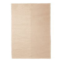 Beige area rug with a textured pattern, featuring smooth and plush sections in complementary tones.