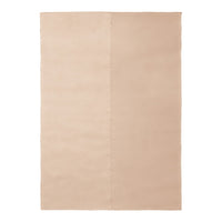 Beige double-sided rug with a soft texture, featuring a seamless, minimalist design ideal for modern spaces.
