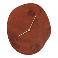 Rustic brown clock with a smooth finish and unique patterns, featuring gold hands for an elegant touch.