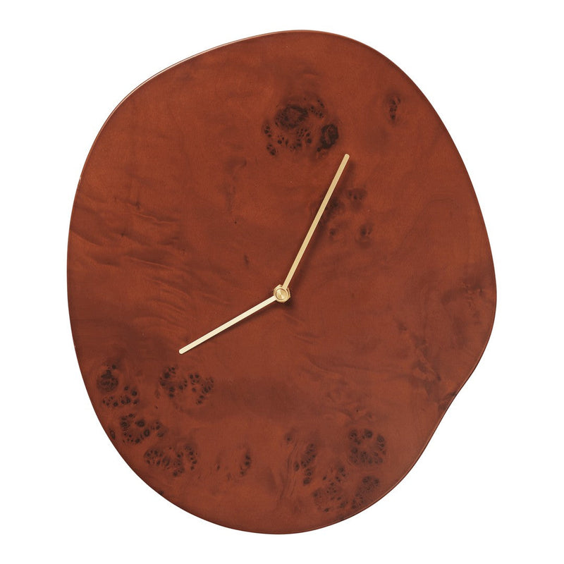 Rustic brown clock with a smooth finish and unique patterns, featuring gold hands for an elegant touch.