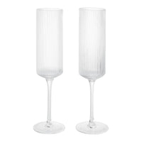 Clear ribbed glass champagne flutes with elegant tall stems, perfect for special occasions and celebrations.