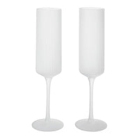 White ribbed champagne flutes with a sleek, modern design and elegant tall stems, perfect for any celebration.
