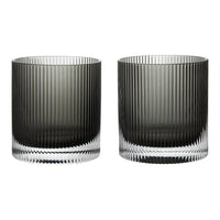 Set of two glass cups in smoky gray with elegant vertical ribbed patterns and clear bases.