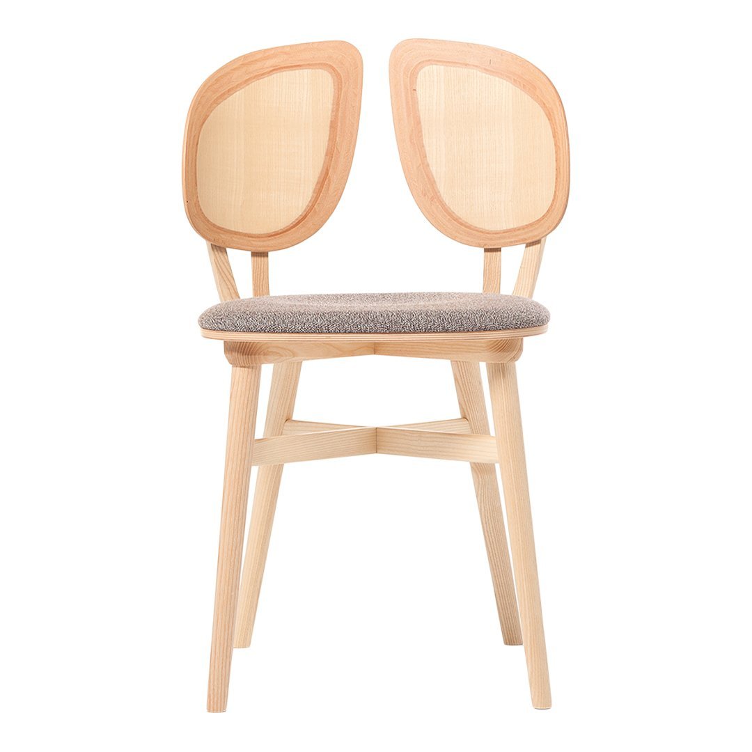 Natural wood chair with light beige upholstery and subtle rounded, open-back design. Modern and minimalist aesthetic.