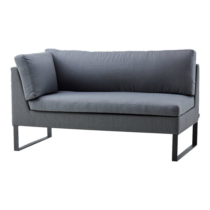 Gray upholstered sofa with a minimalist design, featuring a solid color and textured fabric. Modern metal frame.