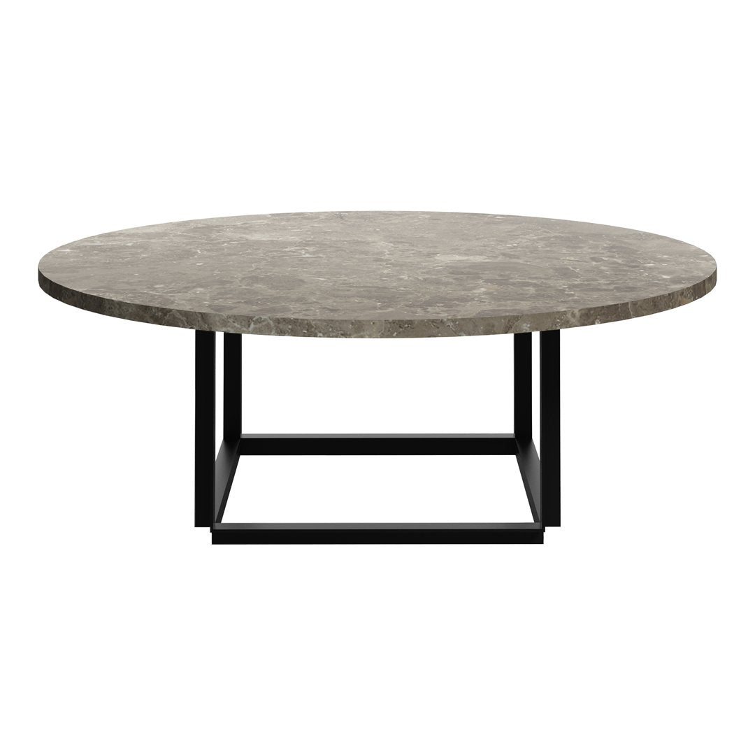 Round coffee table with a textured gray marble top and a sleek black metal base. Stylish and modern design.