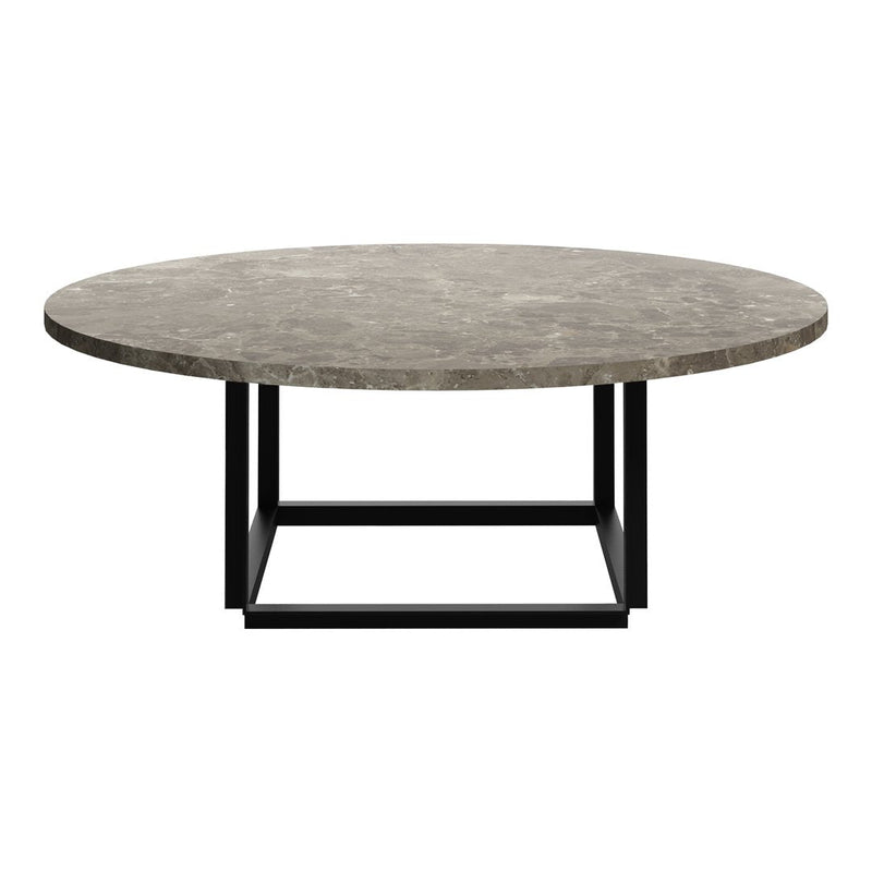 Round coffee table with a textured gray marble top and a sleek black metal base. Stylish and modern design.