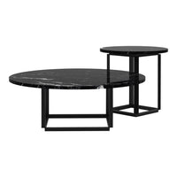 Black marble round coffee tables with striking white veining and sleek black metal bases. Stylish and modern design.