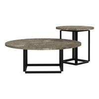 Set of round coffee tables featuring textured gray stone tops and sleek black metal bases. Modern design.