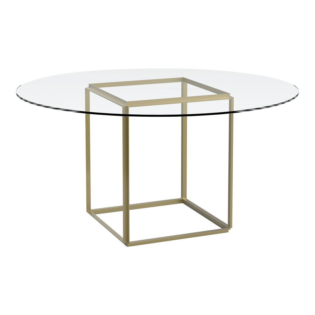 Round glass table with a sleek gold geometric base, featuring a minimalist design suitable for modern decor.