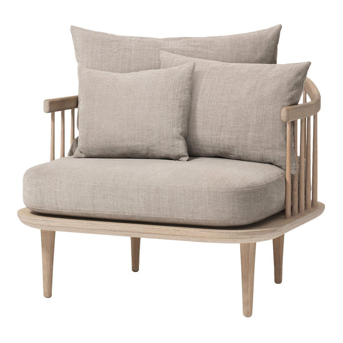 Light beige sofa with plush cushions, featuring a natural wood frame and a minimalist design.