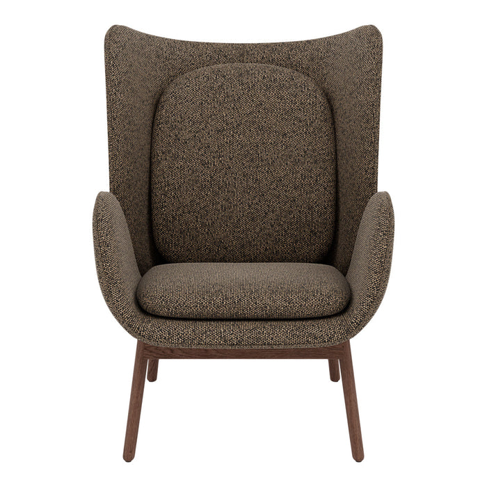 Brown patterned accent chair with a modern silhouette and tapered wooden legs. Soft, textured upholstery.