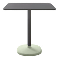 Rectangular table with a sleek black top and a soft green base, featuring a minimalist design and modern color palette.