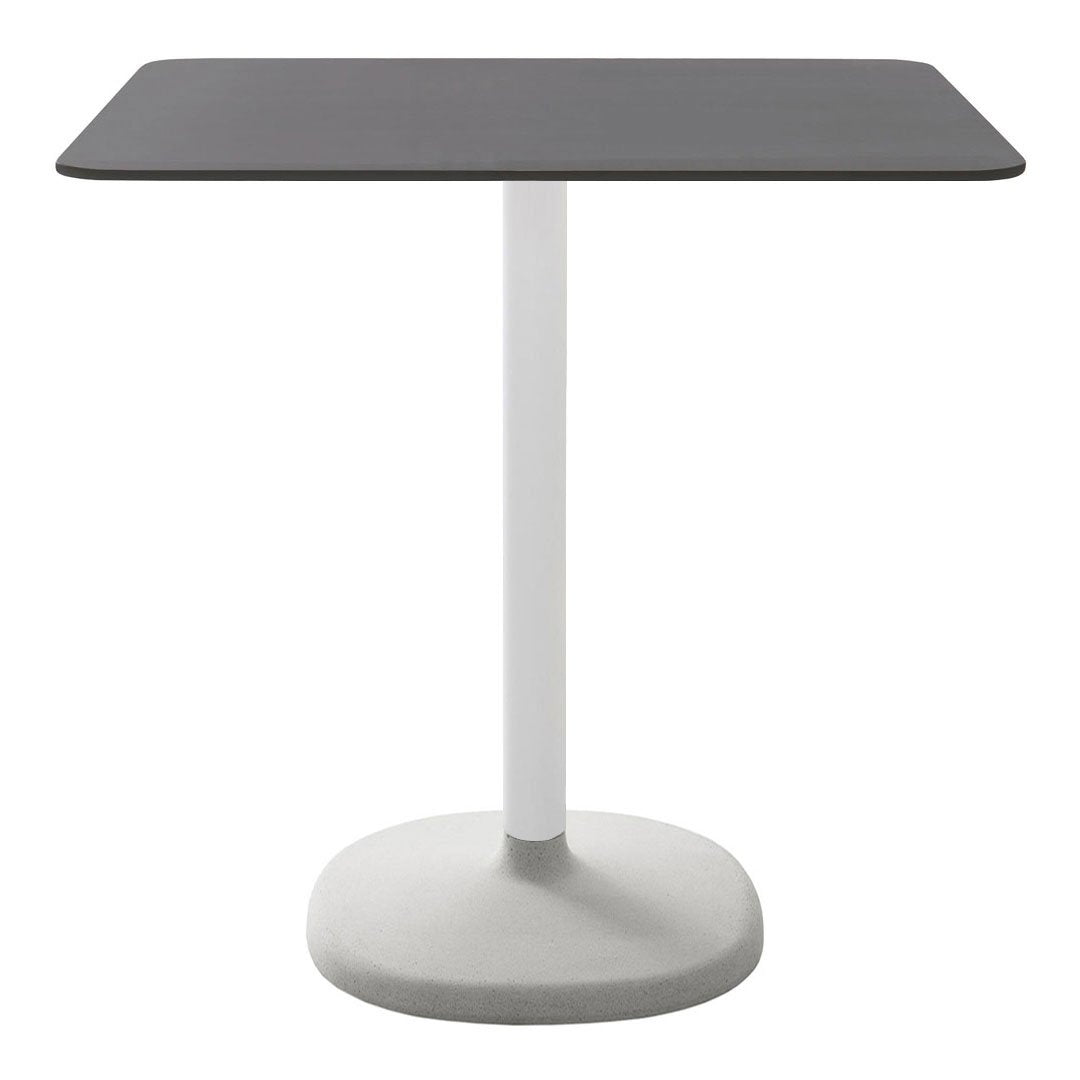 Modern square table with a sleek black top and a minimalist white pedestal base. Perfect for any contemporary space.