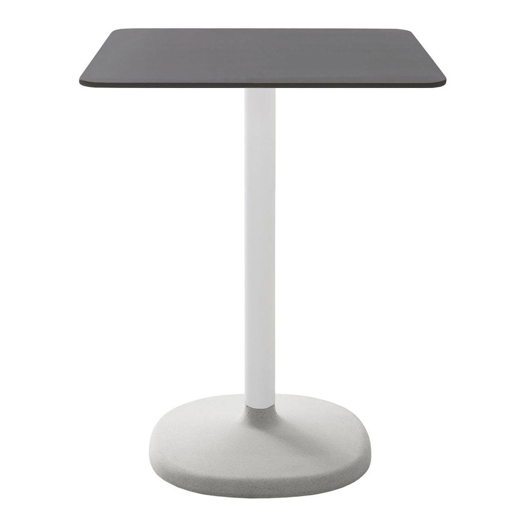 Modern minimalist table with a matte black square top and a sturdy white circular base. Perfect for any decor.