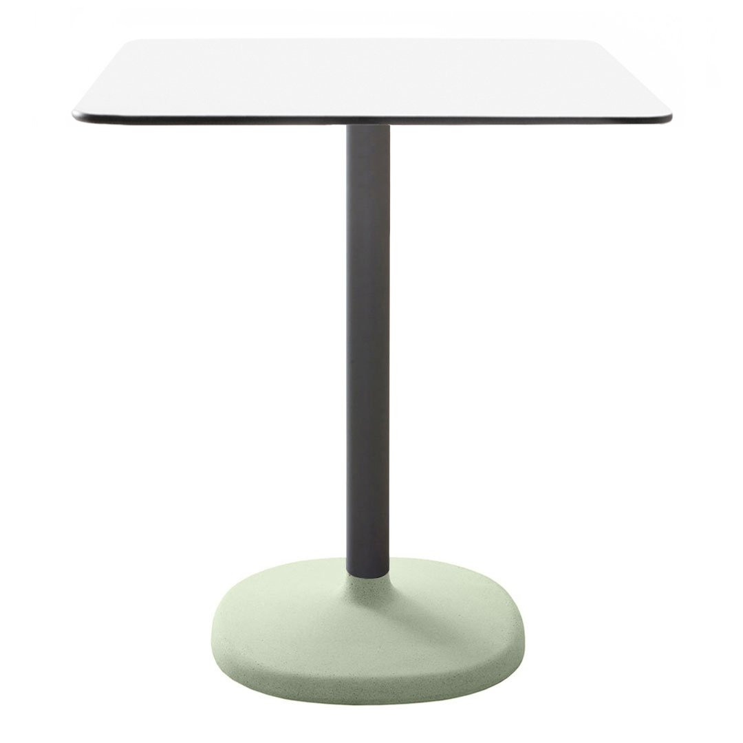 Square white tabletop with a sleek gray metal base and a soft green circular foot, minimalist design.