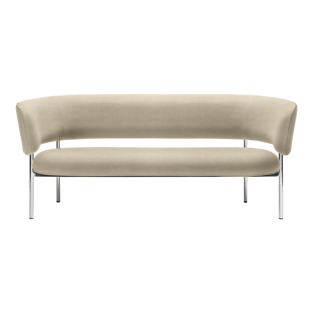 Beige curved sofa with smooth upholstery and minimalist chrome legs, perfect for modern interiors.