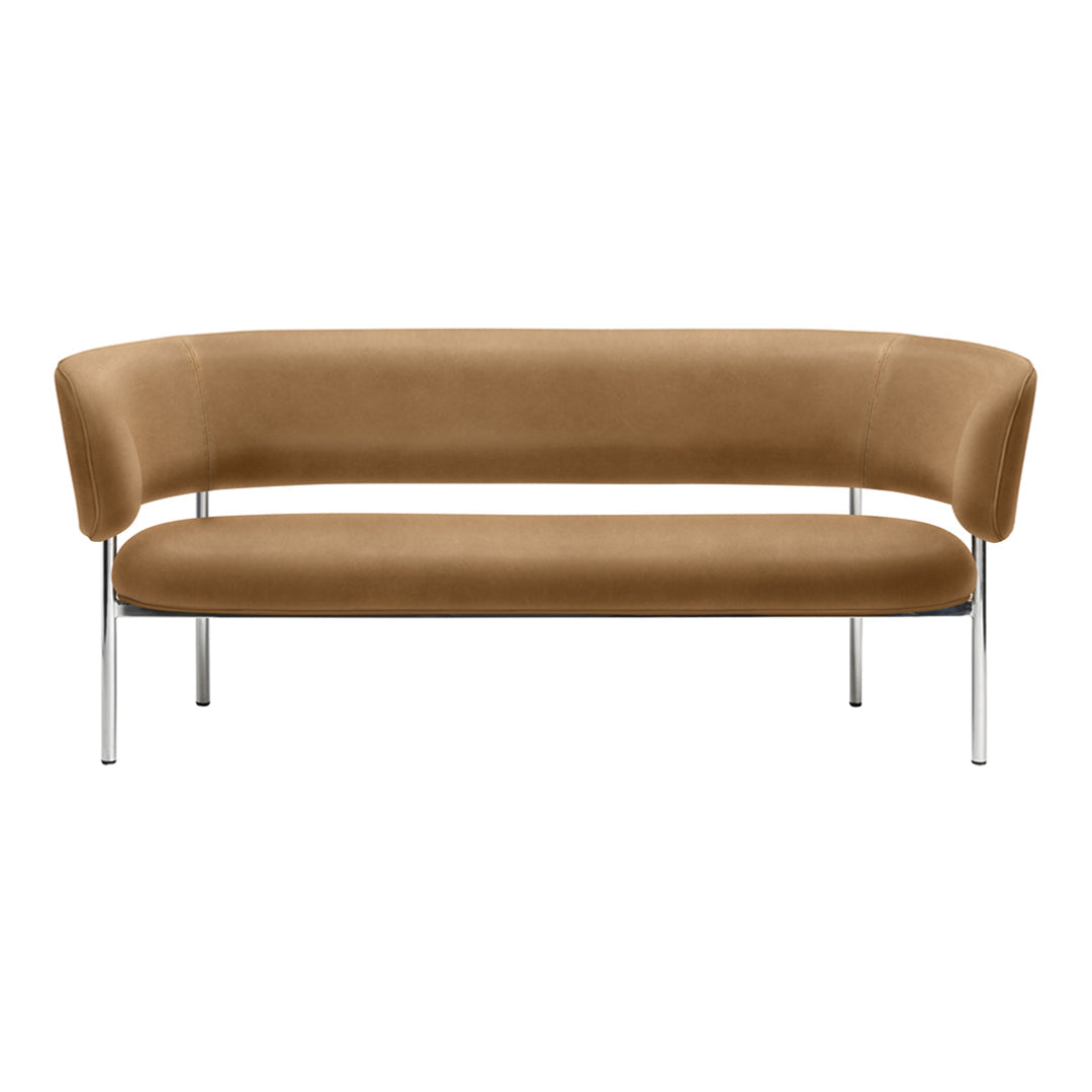 Modern curved sofa in warm brown velvet with sleek chrome legs, perfect for stylish interiors.