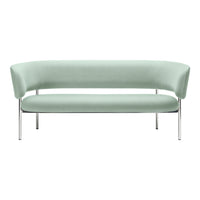 Mint green curved sofa with sleek chrome legs, featuring a smooth, minimalist design. Ideal for modern decor.