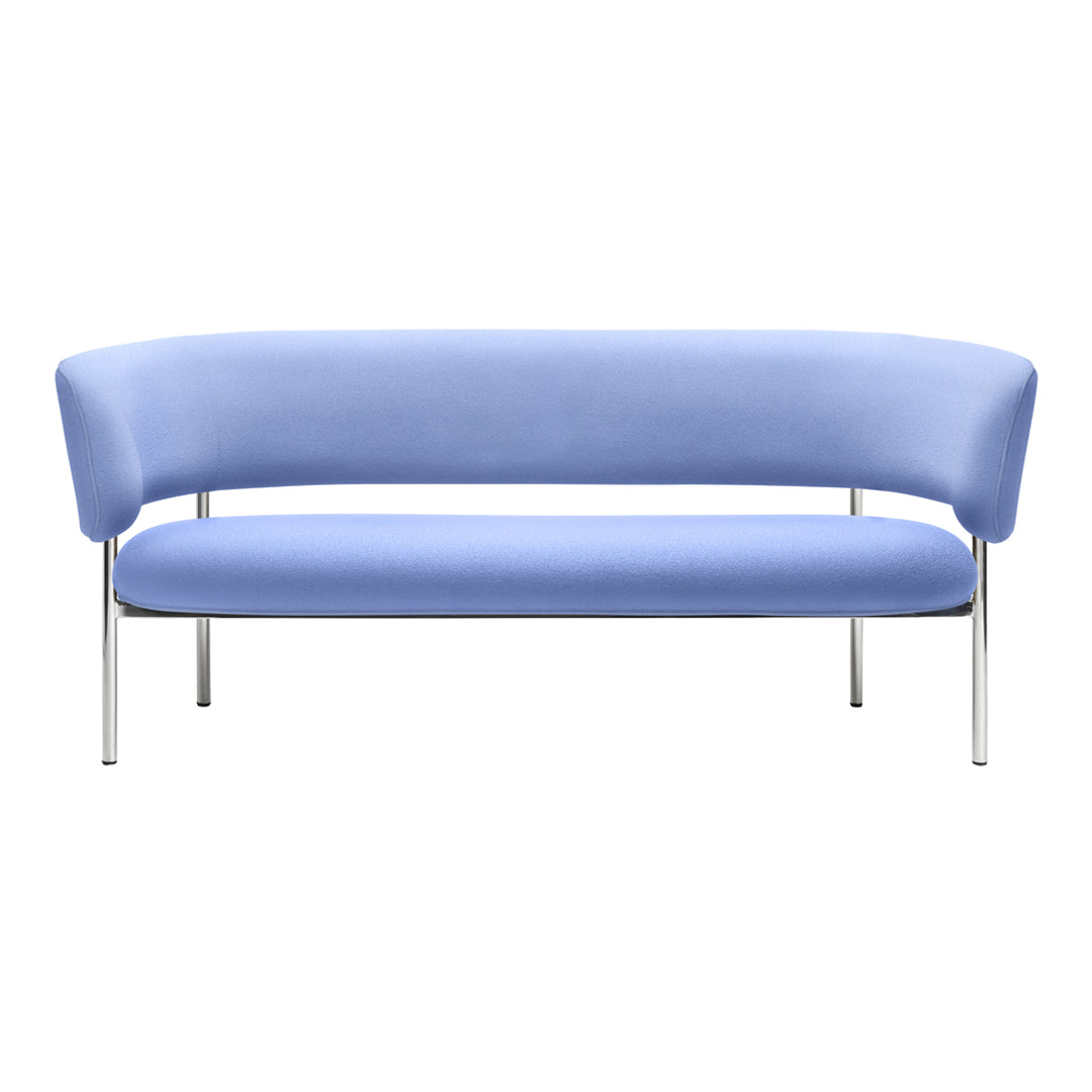 Modern curved sofa in soft light blue fabric with sleek chrome legs. Perfect for contemporary living spaces.