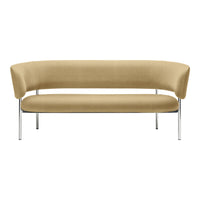 Curved sofa in soft beige upholstery with sleek chrome legs, showcasing a minimalist design. Perfect for modern decor.