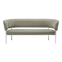 Curved gray sofa with a smooth, textured fabric and sleek chrome legs, ideal for modern living spaces.