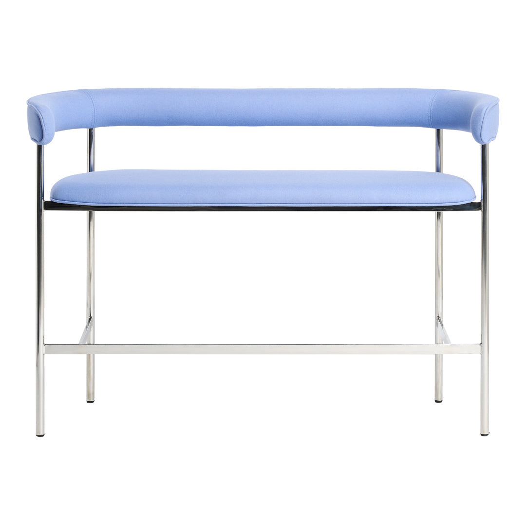 Light blue upholstered bench with sleek chrome legs and minimalist design. Ideal for modern decor.