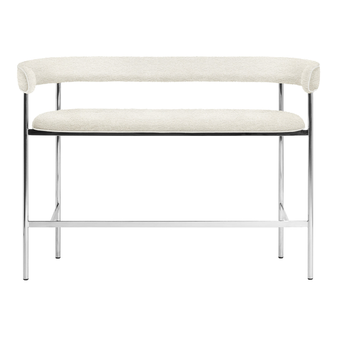 Cream upholstered bench with a sleek chrome frame, featuring a minimalist design and seamless curves.