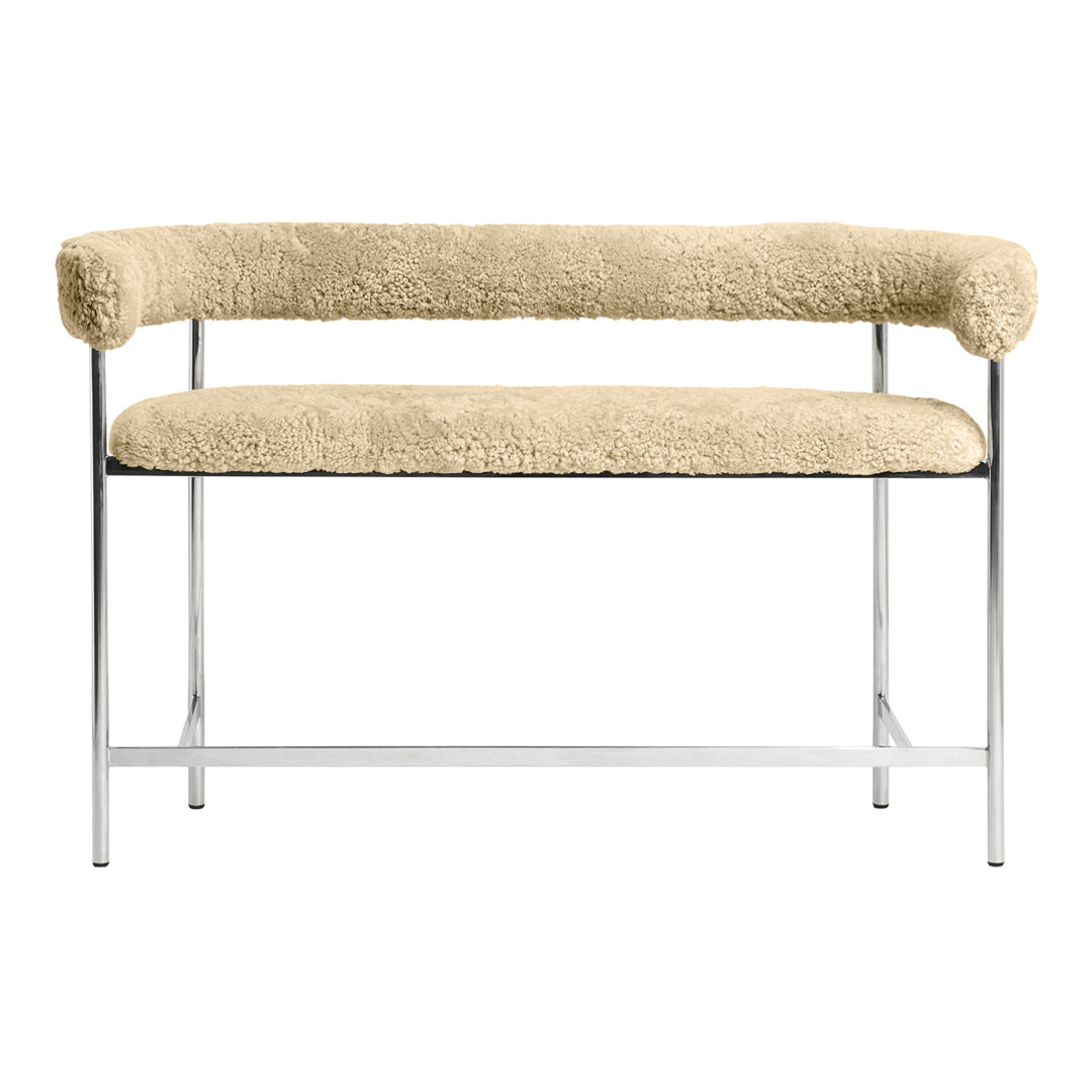 Beige faux fur bench with a sleek chrome frame, featuring a smooth and cozy texture. Modern, minimalist design.