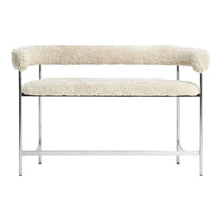 Cream faux shearling bench with stainless steel frame, featuring a minimalist design and soft, textured upholstery.