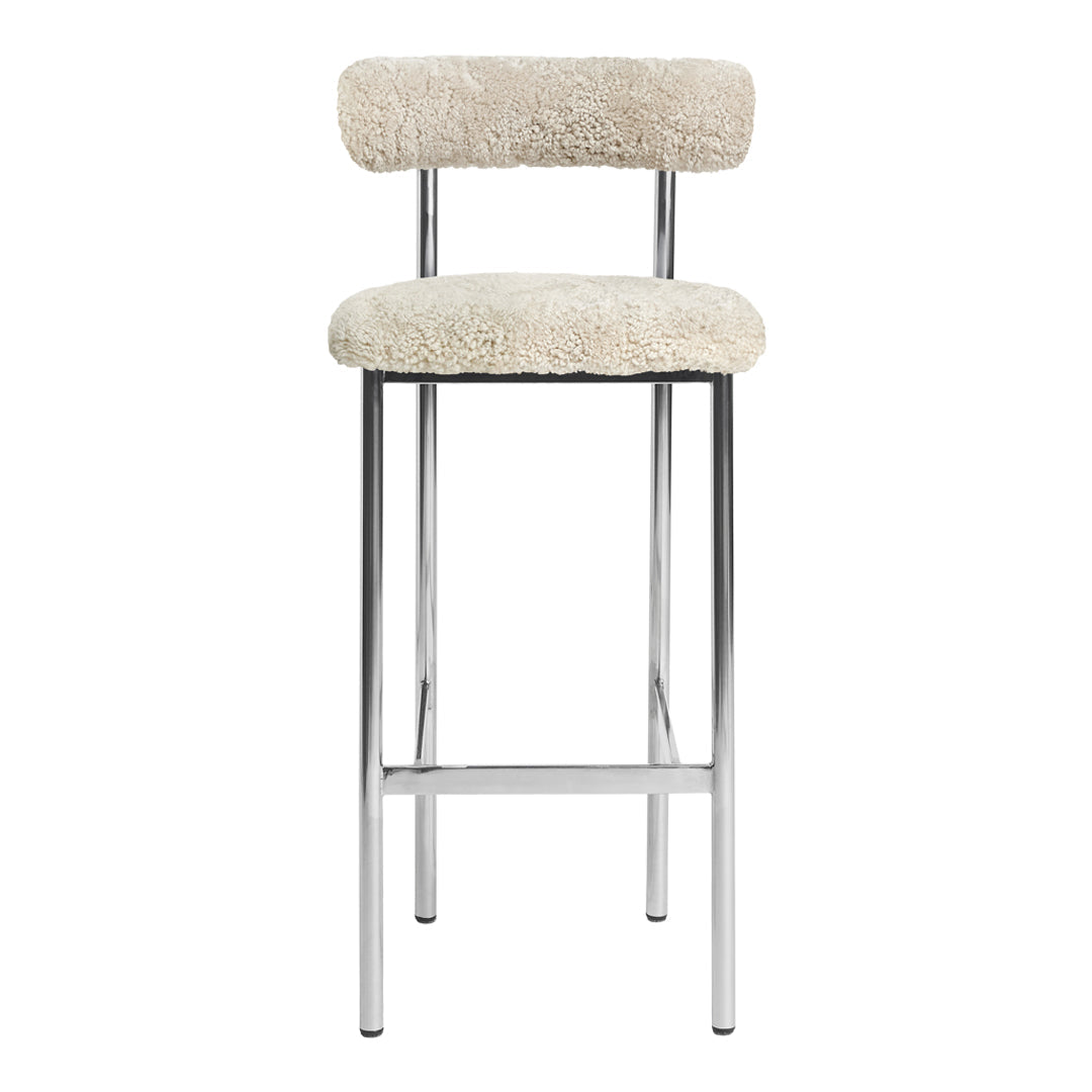 Cream faux shearling bar stool with sleek chrome legs and modern, minimalist design.