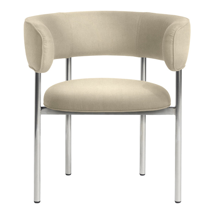 Beige velvet chair with curved back and chrome legs, featuring a smooth, minimalist design. Perfect for modern decor.
