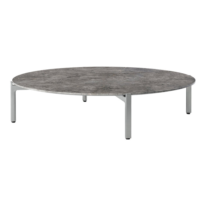 Round coffee table with a textured gray surface and sleek silver legs, perfect for modern decor.