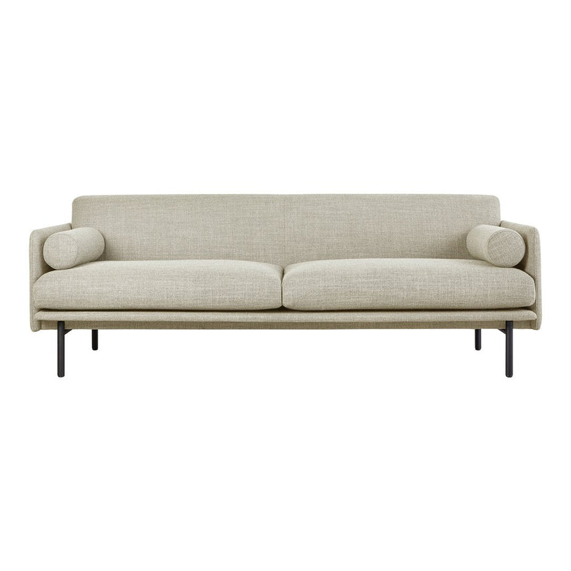 Beige upholstered sofa with a subtle texture and minimalist black metal legs, featuring two matching round cushions.
