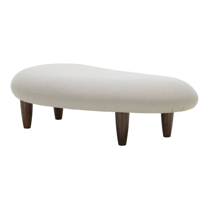 Cream-colored tufted ottoman with smooth, rounded edges and dark wooden legs, adding a modern accent to any space.