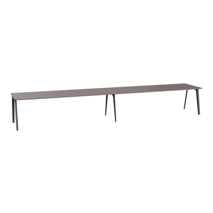 Long rectangular table in a sleek dark brown finish with minimalistic black legs. Perfect for modern decor.