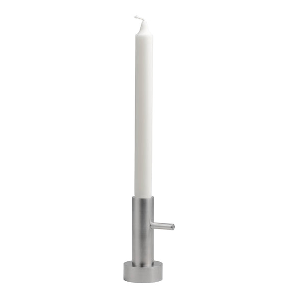 Sleek silver candlestick holder with a tall white candle, perfect for modern decor.