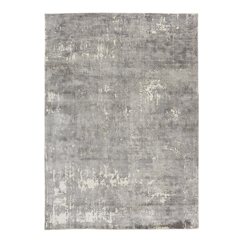 "Rectangular gray rug with subtle patterns and a textured, distressed finish."