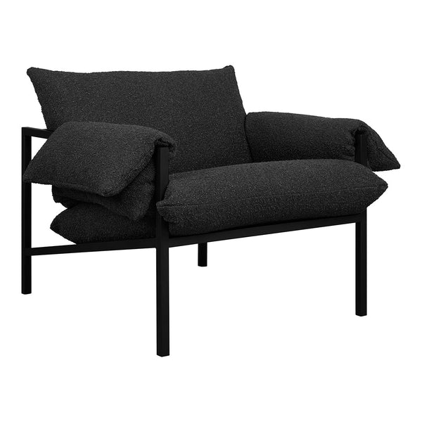 Black linen armchair with oversized cushions and a sleek black metal frame, featuring a modern, minimalist design.