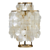 Elegant white shell lamp with a layered, circular pattern and gold accents for a chic coastal ambiance.