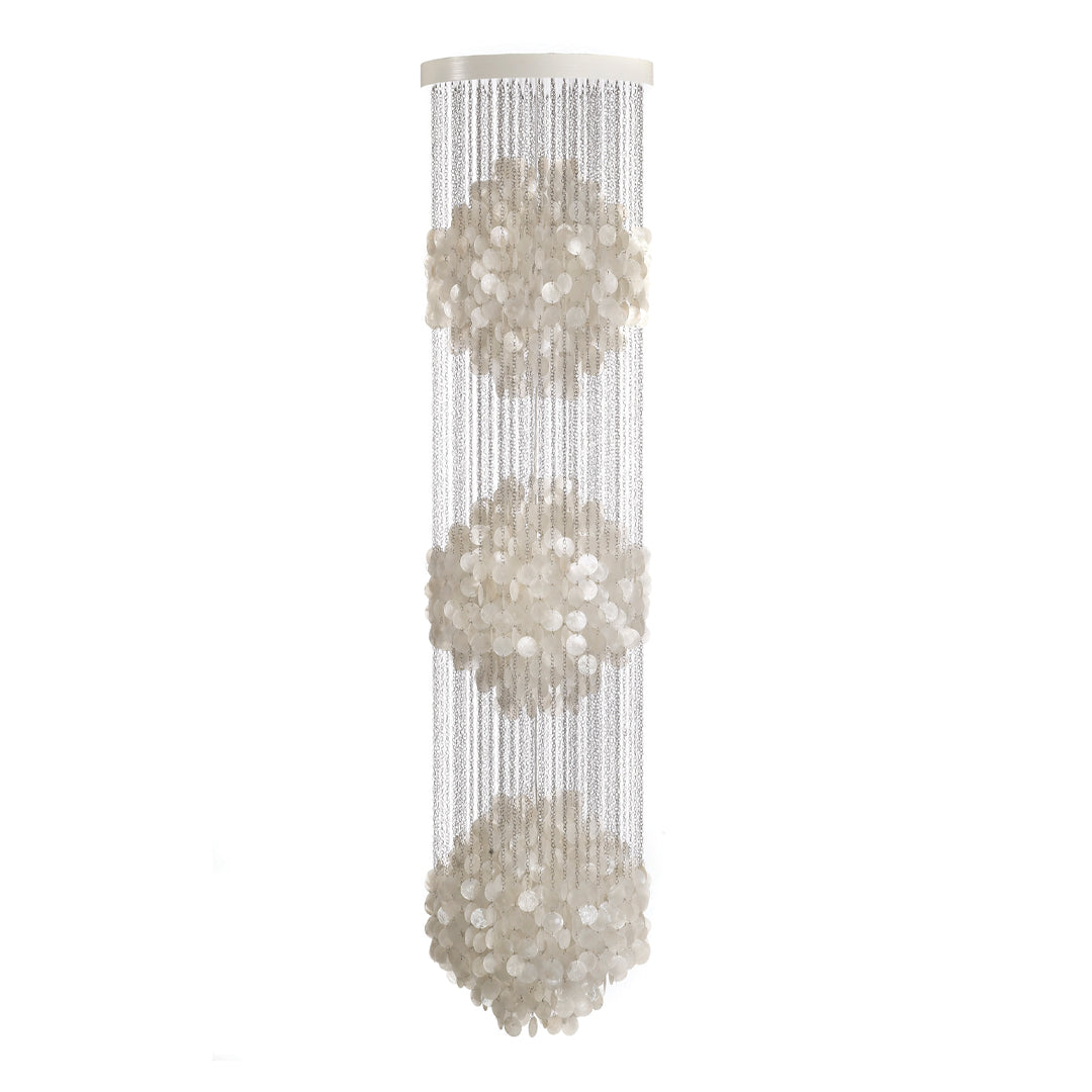 Elegant white floral pattern on a transparent hanging chandelier, featuring three symmetrical designs.