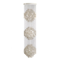 Elegant white floral pattern on a transparent hanging chandelier, featuring three symmetrical designs.
