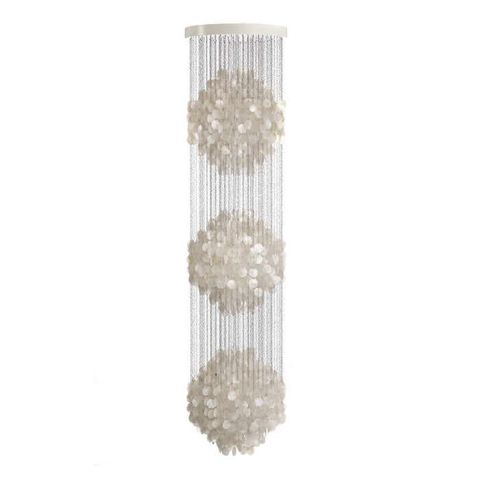 Elegant white floral pattern on a transparent hanging chandelier, featuring three symmetrical designs.
