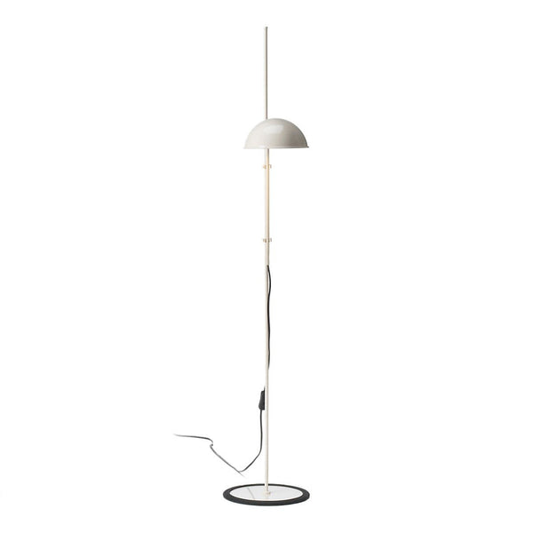 Modern floor lamp in white and black with a sleek, minimalistic design featuring a curved shade and circular base.