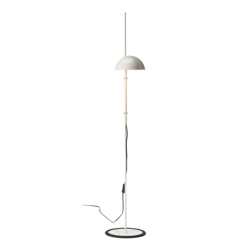 Modern floor lamp in white and black with a sleek, minimalistic design featuring a curved shade and circular base.